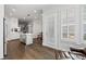Spacious kitchen with white cabinets, stainless appliances and view of a living area at 18 Peachtree Ne Ave # 5, Atlanta, GA 30305