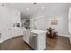 Modern kitchen with white cabinets, stainless steel appliances and center island at 18 Peachtree Ne Ave # 5, Atlanta, GA 30305