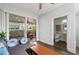 Comfortable living room with hardwood floors, a plush couch, and a patio at 18 Peachtree Ne Ave # 5, Atlanta, GA 30305