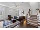Relaxing living room with hardwood floors, neutral rug, stairs and comfortable seating at 18 Peachtree Ne Ave # 5, Atlanta, GA 30305