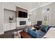 Cozy living room with a modern fireplace, built-in shelves, and comfortable seating at 18 Peachtree Ne Ave # 5, Atlanta, GA 30305