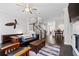 Comfortable living room area with hardwood floors, ceiling fan, and decorative accents at 18 Peachtree Ne Ave # 5, Atlanta, GA 30305