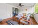 Relaxing covered patio featuring comfortable seating, city views and a ceiling fan at 18 Peachtree Ne Ave # 5, Atlanta, GA 30305