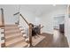Carpeted staircase with a desk area on the landing and a view into another room at 18 Peachtree Ne Ave # 5, Atlanta, GA 30305
