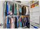 Organized walk-in closet with shelving and hanging space for clothes, shoes, and accessories at 18 Peachtree Ne Ave # 5, Atlanta, GA 30305