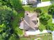 Birds-eye view of a beautiful property with a well-manicured lawn, mature trees, and a spacious driveway at 2845 Aquitania Ln, Cumming, GA 30040