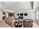 Finished basement with a comfortable seating area and multiple televisions for entertainment at 2845 Aquitania Ln, Cumming, GA 30040