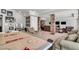 Finished basement showcasing a recreational area with an air hockey table, stone columns and a seating area at 2845 Aquitania Ln, Cumming, GA 30040