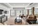 Finished basement featuring a seating area and glass doors providing ample natural light at 2845 Aquitania Ln, Cumming, GA 30040