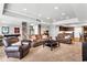 Finished basement featuring a cozy seating area, stone columns, and a kitchenette at 2845 Aquitania Ln, Cumming, GA 30040
