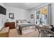 Cozy bedroom with neutral carpet, and large sliding glass doors to outside at 2845 Aquitania Ln, Cumming, GA 30040