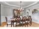 Traditional dining room with hardwood floors and decorative crown molding at 2845 Aquitania Ln, Cumming, GA 30040