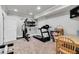 Home gym equipped with exercise machines, providing a convenient space for fitness and wellness at 2845 Aquitania Ln, Cumming, GA 30040