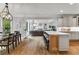 Open concept kitchen with a large island, stainless appliances, and views to living area at 2845 Aquitania Ln, Cumming, GA 30040