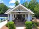 Charming pavilion with a fireplace, seating, and stone accents next to the tennis courts at 2845 Aquitania Ln, Cumming, GA 30040