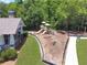 Outdoor playground featuring slides, swings, and green space for enjoyment at 2845 Aquitania Ln, Cumming, GA 30040