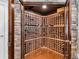 Spacious wine cellar featuring custom wood racking and stone accents, perfect for wine enthusiasts at 2845 Aquitania Ln, Cumming, GA 30040