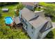 Aerial view of the property featuring a pool, deck, backyard, and the home's roofline at 684 Doe Lane Ln, Loganville, GA 30052
