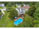 Aerial view of the home featuring a pool, deck and plenty of backyard space at 684 Doe Lane Ln, Loganville, GA 30052