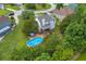 Aerial view of a home's backyard featuring a large pool and deck area for outdoor relaxation at 684 Doe Lane Ln, Loganville, GA 30052