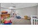 Finished basement area with carpet floors, toys and storage at 684 Doe Lane Ln, Loganville, GA 30052
