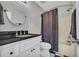 Charming bathroom features granite countertop, dark fixtures, with a shower and tub at 684 Doe Lane Ln, Loganville, GA 30052