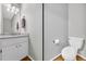 Half bath with granite counter and modern fixtures at 684 Doe Lane Ln, Loganville, GA 30052
