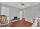 Comfortable bedroom with hardwood floors and neutral paint, offering a serene and inviting atmosphere at 684 Doe Lane Ln, Loganville, GA 30052