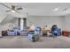 Versatile bonus room with plush carpeting, seating, and a desk area, ideal for work or leisure at 684 Doe Lane Ln, Loganville, GA 30052