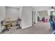 Carpeted bonus room features neutral walls and space to entertain in a versatile living space at 684 Doe Lane Ln, Loganville, GA 30052