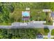 Aerial view featuring community pool, playground, clubhouse, and picnic tables at 684 Doe Lane Ln, Loganville, GA 30052