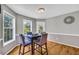 Cozy dining area features hardwood floors, chair rail, and natural light from windows at 684 Doe Lane Ln, Loganville, GA 30052