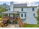 Rear exterior of home with deck, patio, and bay window at 684 Doe Lane Ln, Loganville, GA 30052