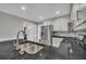 Updated kitchen featuring stainless steel appliances, granite counters, and modern finishes at 684 Doe Lane Ln, Loganville, GA 30052