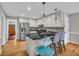 Bright kitchen features stainless steel appliances, granite countertops, and breakfast bar seating at 684 Doe Lane Ln, Loganville, GA 30052