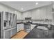 Well-appointed kitchen with stainless steel appliances, granite counters, and modern fixtures at 684 Doe Lane Ln, Loganville, GA 30052