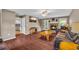 Cozy living room featuring a stone fireplace, hardwood floors, and leather furniture at 684 Doe Lane Ln, Loganville, GA 30052