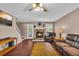 Comfortable living room with a stone fireplace, hardwood flooring, and access to outdoor at 684 Doe Lane Ln, Loganville, GA 30052