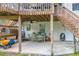 Covered patio area featuring neutral toned outdoor seating and concrete floor at 684 Doe Lane Ln, Loganville, GA 30052