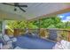 Inviting covered patio with ample seating and views of the lush, wooded surroundings at 684 Doe Lane Ln, Loganville, GA 30052