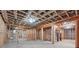 Unfinished basement with exposed ceilings and wood beam walls at 10745 Shallowford Rd, Roswell, GA 30075