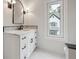 Elegant bathroom features marble floors, quartz countertops, and modern fixtures at 10745 Shallowford Rd, Roswell, GA 30075