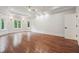 Large bedroom features trey ceilings, hardwood floors, and bright natural light at 10745 Shallowford Rd, Roswell, GA 30075