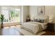 Cozy bedroom featuring a large window offering a beautiful view of the outdoors at 10745 Shallowford Rd, Roswell, GA 30075