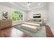 This bedroom features a large arched window that provides ample natural light, with an elegant interior design at 10745 Shallowford Rd, Roswell, GA 30075
