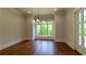 Living room featuring hardwood floors, recessed lights, and view of the backyard at 10745 Shallowford Rd, Roswell, GA 30075