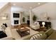 Comfortable living room featuring a fireplace, recessed lighting, and contemporary decor at 10745 Shallowford Rd, Roswell, GA 30075