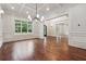 Bright living room boasts hardwood floors, recessed lighting, and coffered ceilings at 10745 Shallowford Rd, Roswell, GA 30075