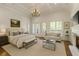 Bright main bedroom with fireplace, sitting area, and balcony access at 10745 Shallowford Rd, Roswell, GA 30075