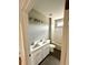Bathroom features double sink vanity and a shower-tub combo, perfect for relaxation at 1273 Jersey Social Circle Rd, Covington, GA 30014